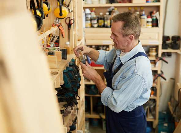 Man Working with Hands After Finding an Answer for His Neuropathy Pain